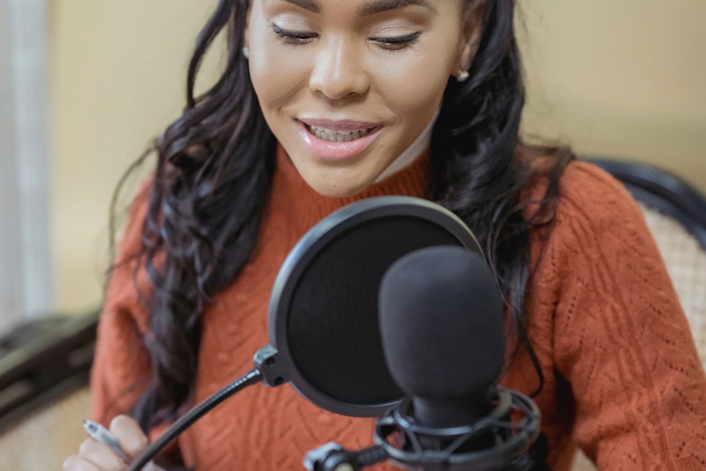 A media creator recording in a studio